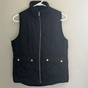 Thread & Supply black puffer vest with gold buttons